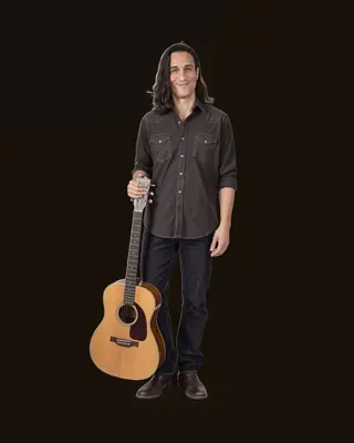 Caleb Schallert 3D action figure — a cutout portrait of Caleb Schallert standing with his acoustic guitar, used as the poster for the interactive 3D figure, Houston — Caleb Schallert.